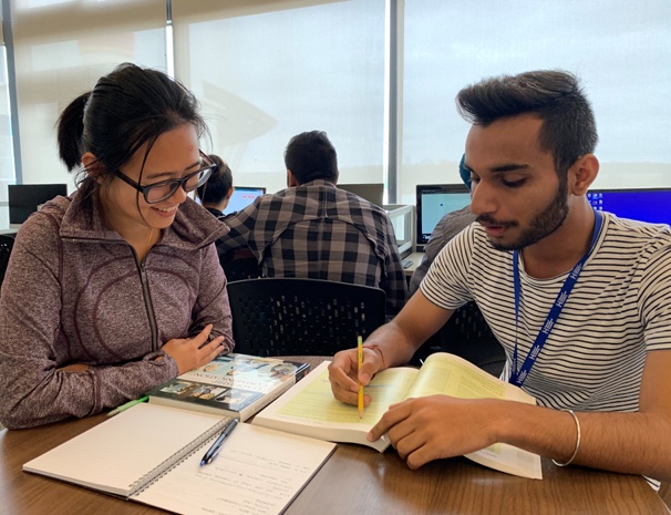 Woman and tutor studying together
