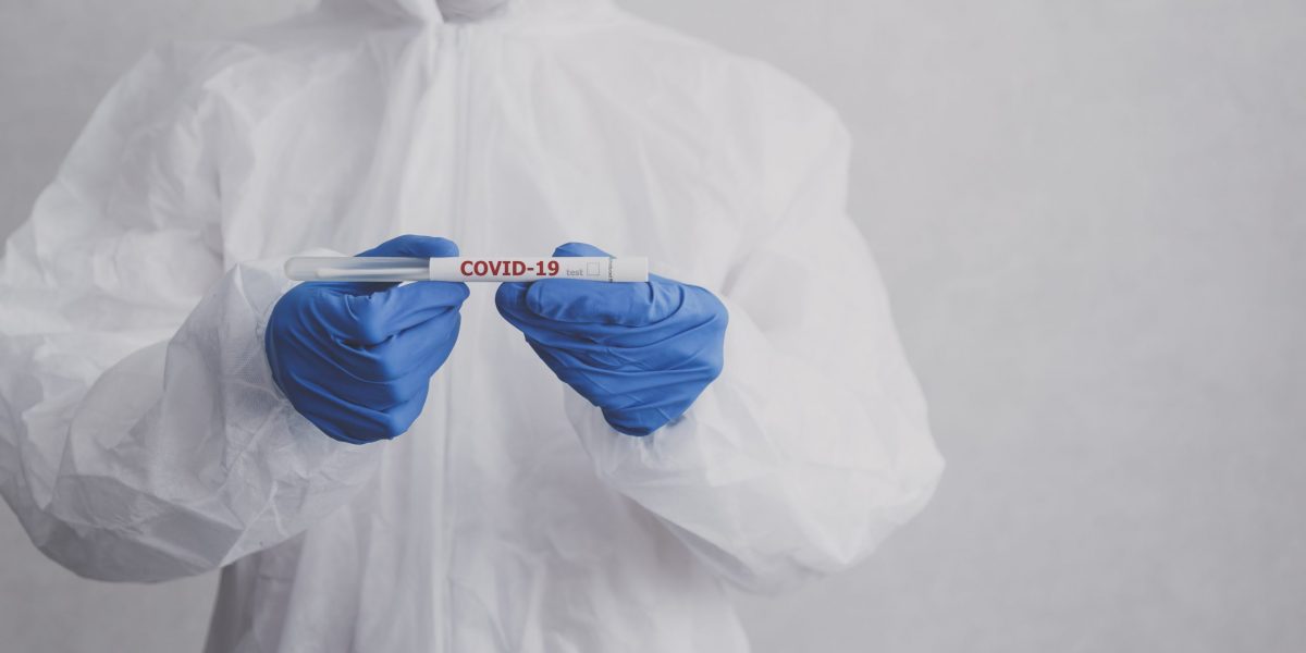 Laboratory technician hold coronavirus test tube